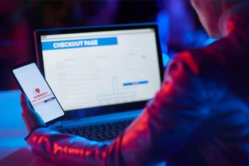 a person checking website on phone, taking precautions against online fraud